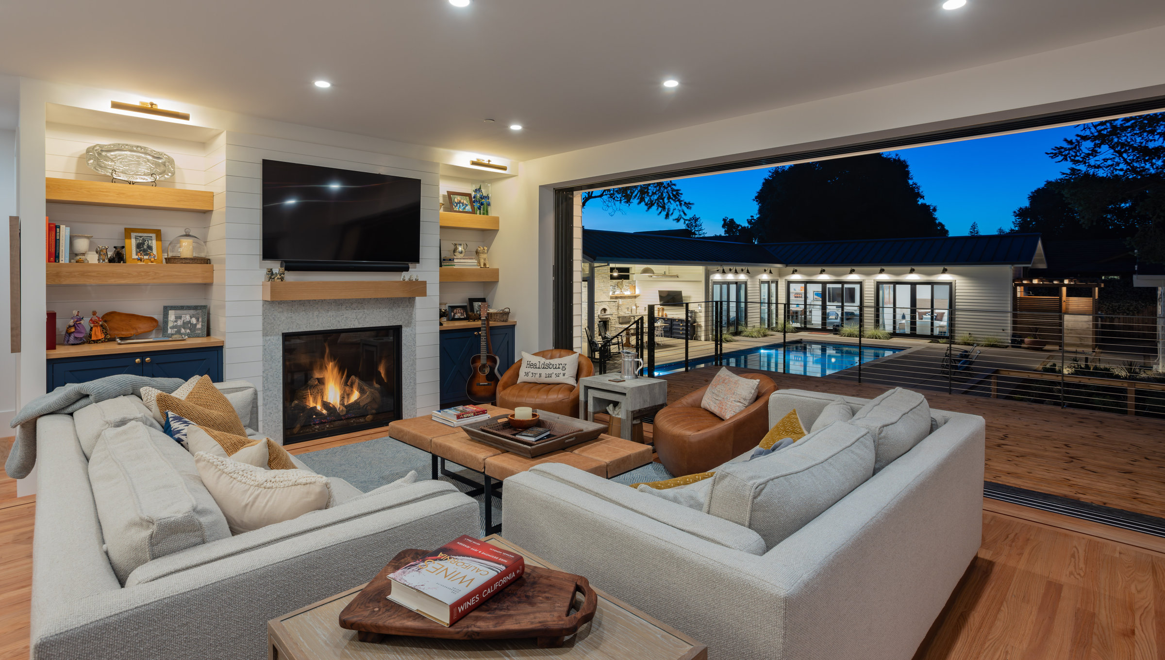 Great room with fireplace open to pool
