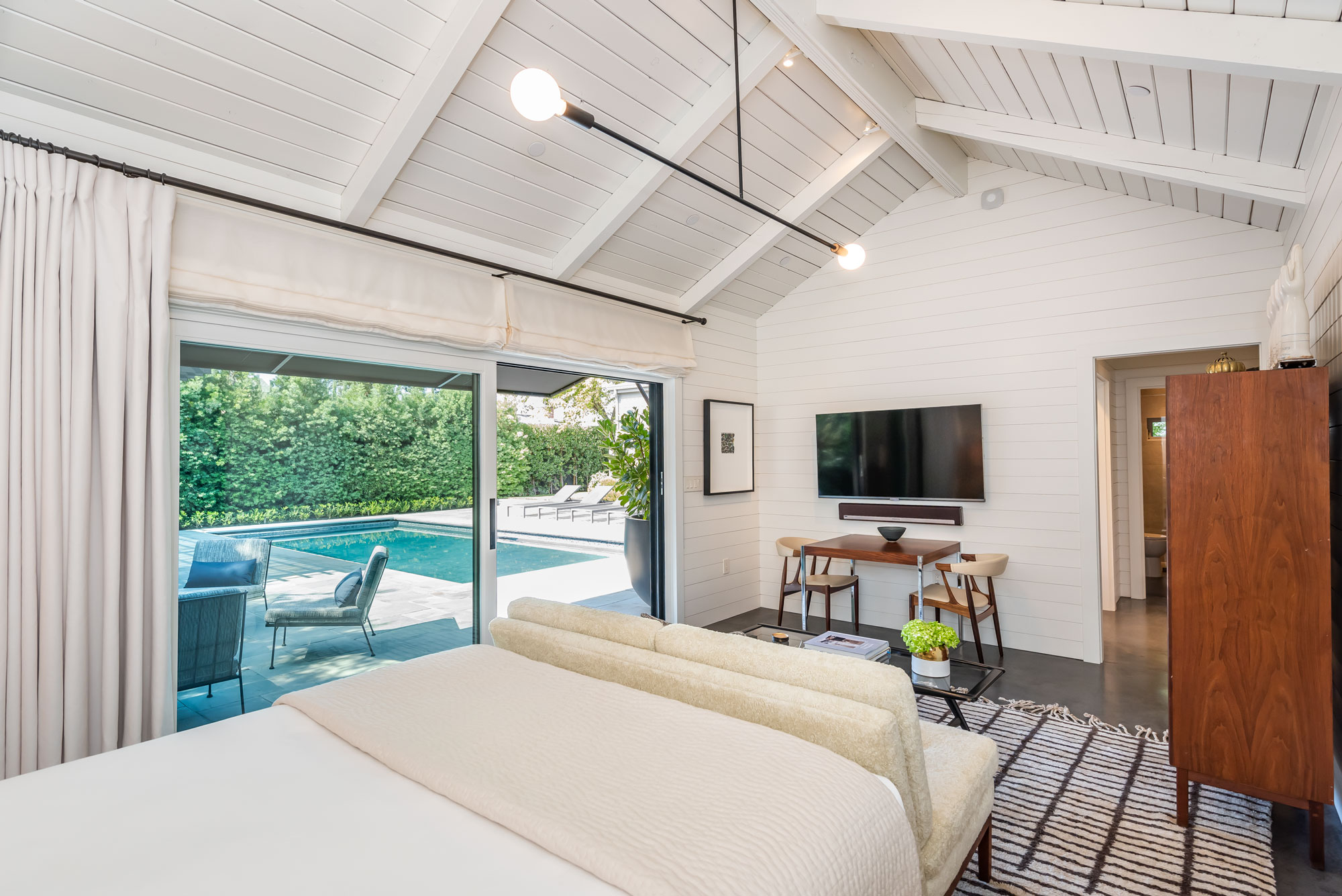 ADU bedroom open to pool