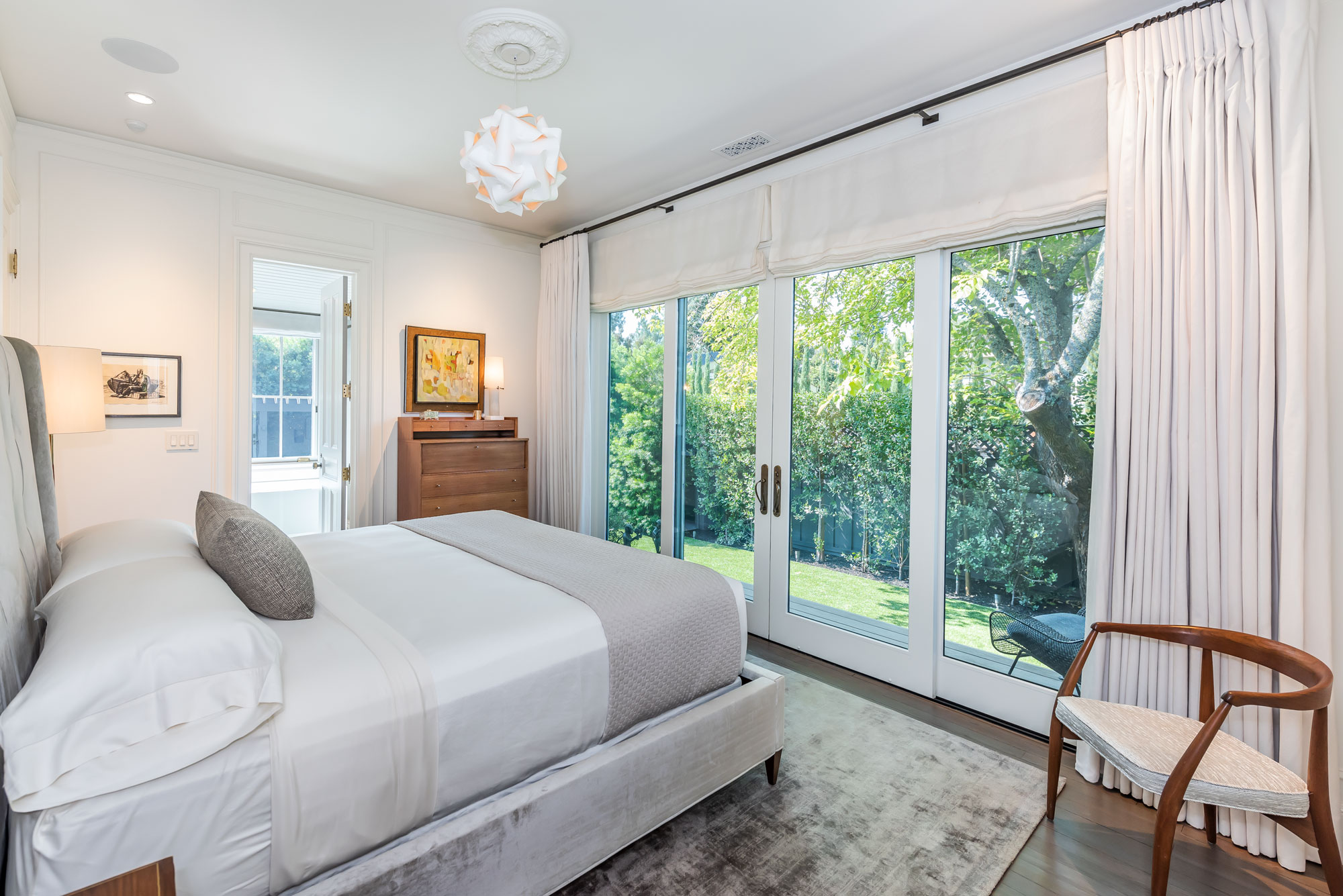 Primary bedroom with garden views